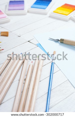 creative hobby tools on white wood