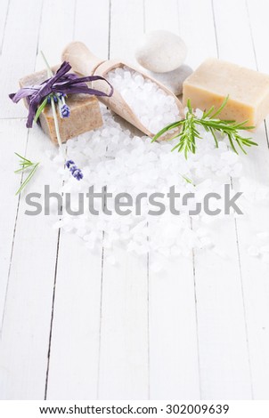 organic soap with lavender flower and bath salt on white wood table