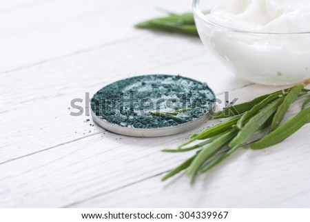 beauty product samples and lavender on white wooden table background