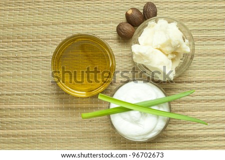 cosmetics cream, shea butter and oil on bamboo background, directly above