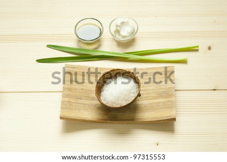 spa setting with bath salts on wooden, directly above