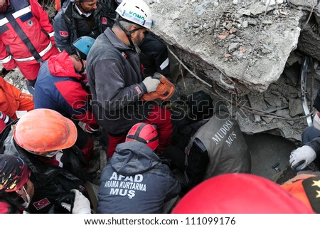 VAN, TURKEY - NOVEMBER 10: Rescue teams are searching through the buildings destroyed during the earthquake in Van on November 10, 2011 in Van, Turkey.