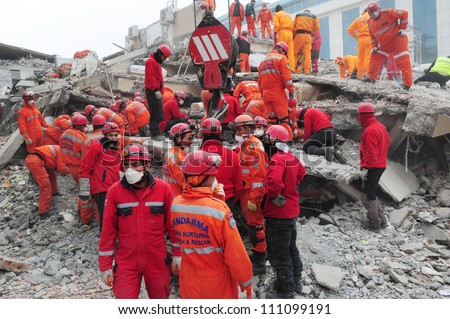 VAN, TURKEY - NOVEMBER 10: Rescue teams are searching through the buildings destroyed during the earthquake in Van on November 10, 2011 in Van, Turkey.