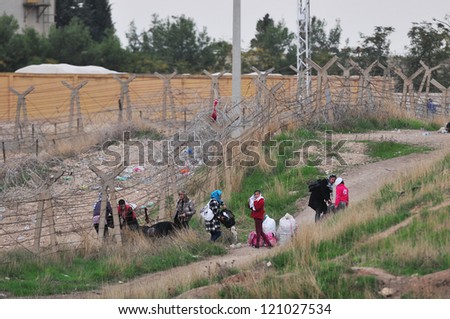 SANLIURFA, TURKEY - NOVEMBER 18: Syrian who have fled the war at home, entered Turkey from the border on November 18, 2012 in Sanliurfa, Turkey.