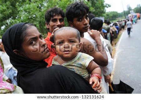 ARAKAN, BANGLADESH - AUGUST 20: Bangladeshi refugee children and women from Arakan go through a hard time in camps, on August 20, 2012 in Arakan, Bangladesh.