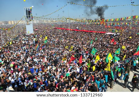 DIYARBAKIR,TURKEY - MARCH 21: Kurds celebrating their traditional feast Newroz that means 'new day' in kurdish on March 21, 2013 in Diyarbakir, Turkey.