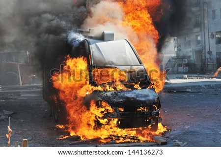 Burning van with large flames and black smoke