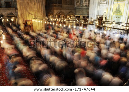 ISTANBUL, TURKEY - JULY 19: People praying at Ramadan night in Blue Mosque on July 19, 2012 in Istanbul, Turkey.