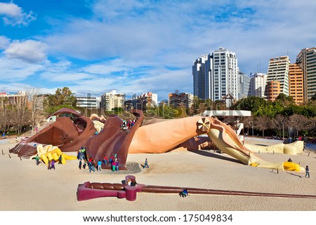 VALENCIA, SPAIN - JANUARY 14, 2014: Gulliver kids park - popular attraction with slides, ramps and ladders on 70 meters sculpture of lying Gulliver. Located in Turia Gardens in Valencia, Spain.