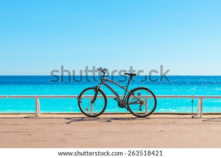 Bicycle on famous Promenade des Anglais as Mediterranean sea on background in Nice, France.
