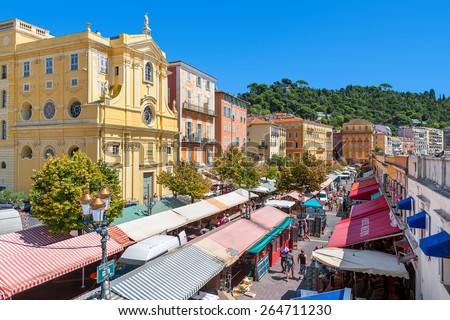NICE, FRANCE - AUGUST 23, 2014: View of Cours Saleya - large pedestrian area famous for its flower, vegetable, spice and fish markets is one of the most popular places in Nice.