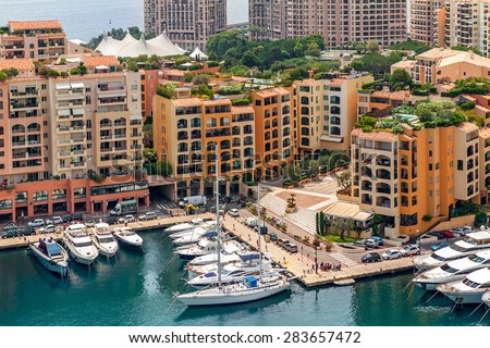 MONTE CARLO, MONACO - JULY 13, 2013: View on small marina and modern building of Monaco - principality on French Riviera, governed under a form of constitutional monarchy by Prince Albert II .