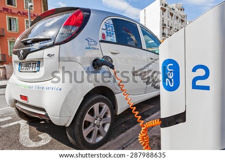 NICE, FRANCE - AUGUST 23, 2014: Electric car at Auto Bleue charging station - popular urban self service car sharing service in Nice with more than sixty stations and over 200 electric vehicles.