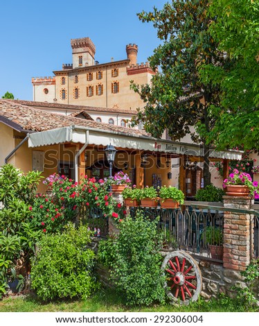 BAROLO, ITALY - MAY 14, 2015: Restaurant and old castle of Barolo (Castello Falletti) - world famous wine town and popular tourists destination of hilly Langhe area in Piedmont, Italy.