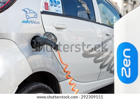 NICE, FRANCE - AUGUST 23, 2014: Electrical car at Auto Bleue charging station - popular urban self service car sharing service in Nice with more than sixty stations and over 200 electric vehicles.