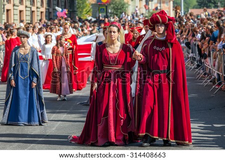 ALBA, ITALY - OCTOBER 02, 2011: Participants in historic dresses on Medieval Parade - traditional part of celebrations during annual White Truffle festival taking place each year in Alba, Italy.