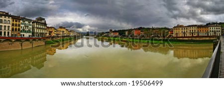 Panoramic view on houses along the Arno river in Florence, Italy.