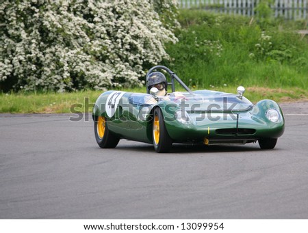 vintage cars racing around sprint racetrack