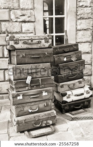 old fashioned luggage cases stacked high