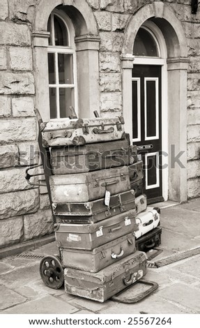 old fashioned luggage cases stacked high