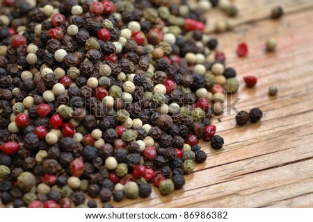 freshly dried peppercorn on wooden table