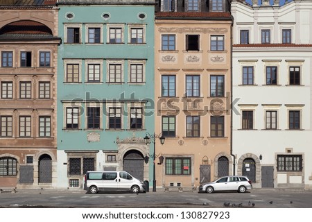 Cars parked on the Old Town Market Place in Warsaw, Poland. Frame is made with tilt-shift lens.