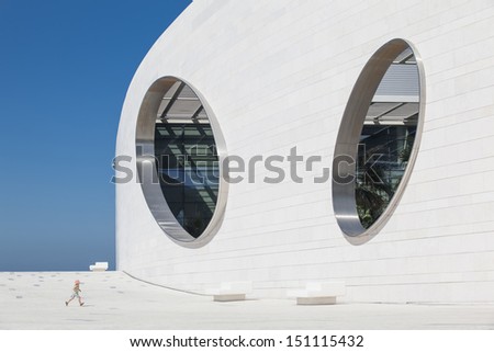 LISBON, PORTUGAL - AUGUST 12: child running in the Champalimaud Centre for the Unknown designed by Charles Correa on August 12, 2013.