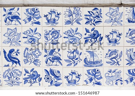 Fragment of the old wall in Lisbon, Portugal. Azulejo is  a typical aspect of Portuguese culture, having been produced without interruption for five centuries.