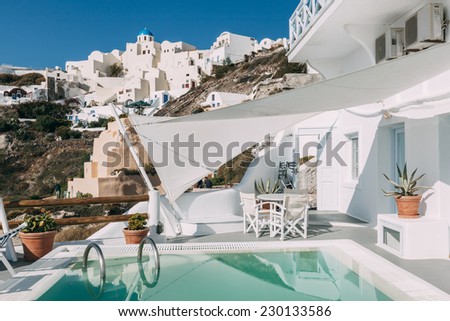 OIA, SANTORINI, GREECE - NOVEMBER 4: inner yard with the pool of Caldera Villas, one of the hotels located in Oia, Santorini, Greece on November 4, 2014.