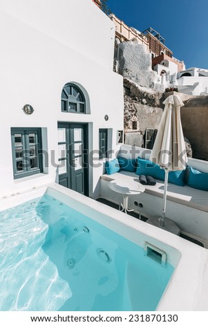 OIA, SANTORINI, GREECE - NOVEMBER 3: swimming pool in inner yard of vacation house in Oia, Santorini, Greece on November 3, 2014.