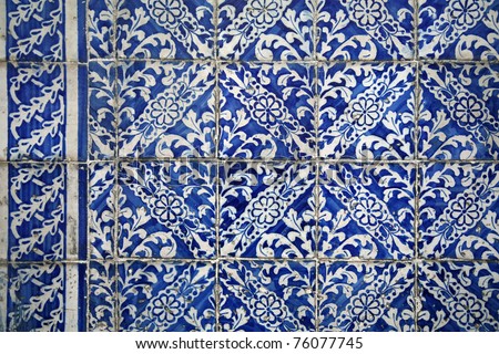 Portuguese stone tiles called azulejo. A wall with the blue stone tiles.