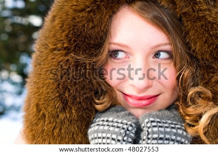 portrait of young woman in fur cap