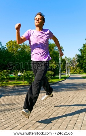 young man running in park