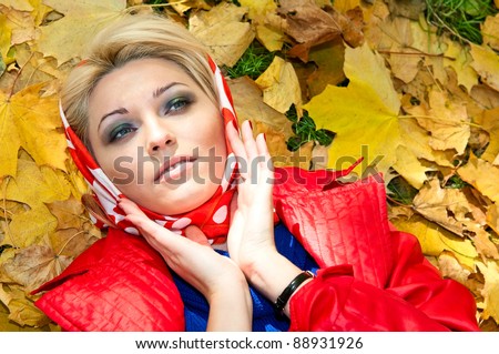 young woman resting on the maple leaves