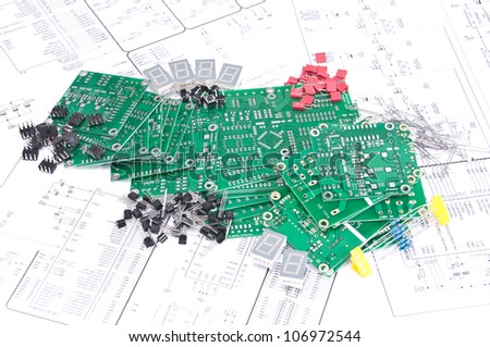 Circuit boards and electronic components with schematics in background