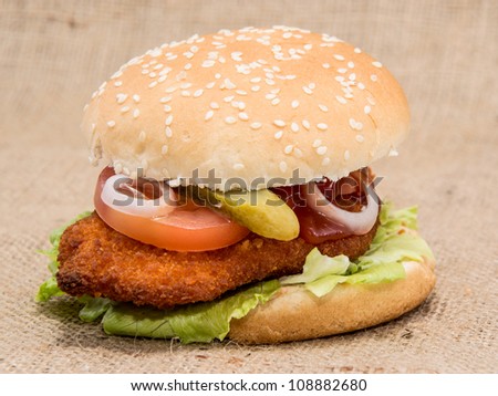 Chicken Burger on rustic background (macro view)