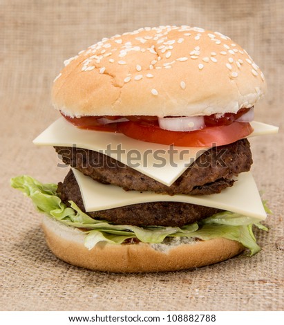 Double Burger on rustic background