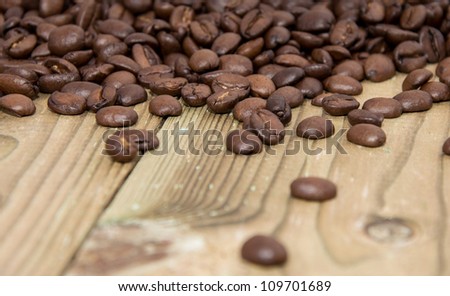 Old wooden Table with Coffee Beans
