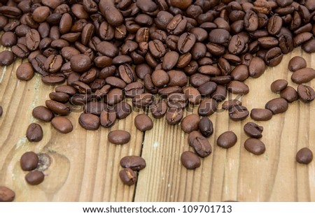 Old wooden Table with Coffee Beans