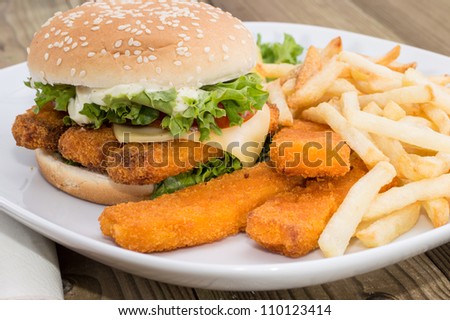 Fish Burger with Chips on wooden background