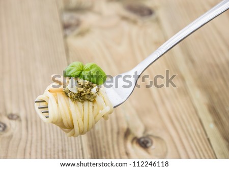 Spaghetti with fresh Pesto Sauce on a fork