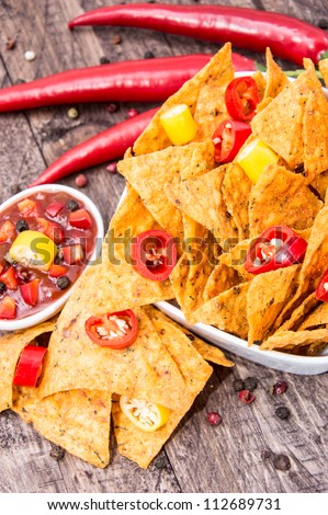 Portion of Nachos with Salsa Sauce on wooden background