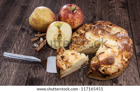 Fresh baked Apple Cake on wooden background