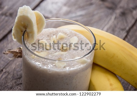 Fresh made Banana Milkshake on wooden background