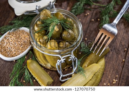 Pickles with fresh dill in a glass