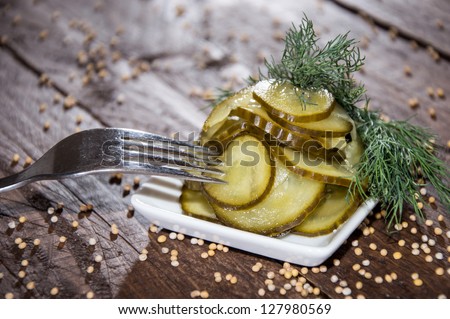 Fresh Cucumber slices with dill on a small plate