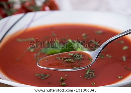 Tomato Soup with Soup on Spoon