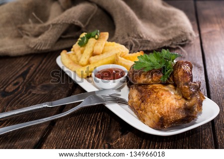 Homemade Grilled Chicken with french fries on a plate