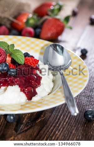 Rice Pudding with fruit sauce and mixed fresh fruits