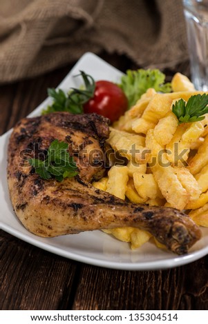 Grilled Chicken with french fries on a plate
